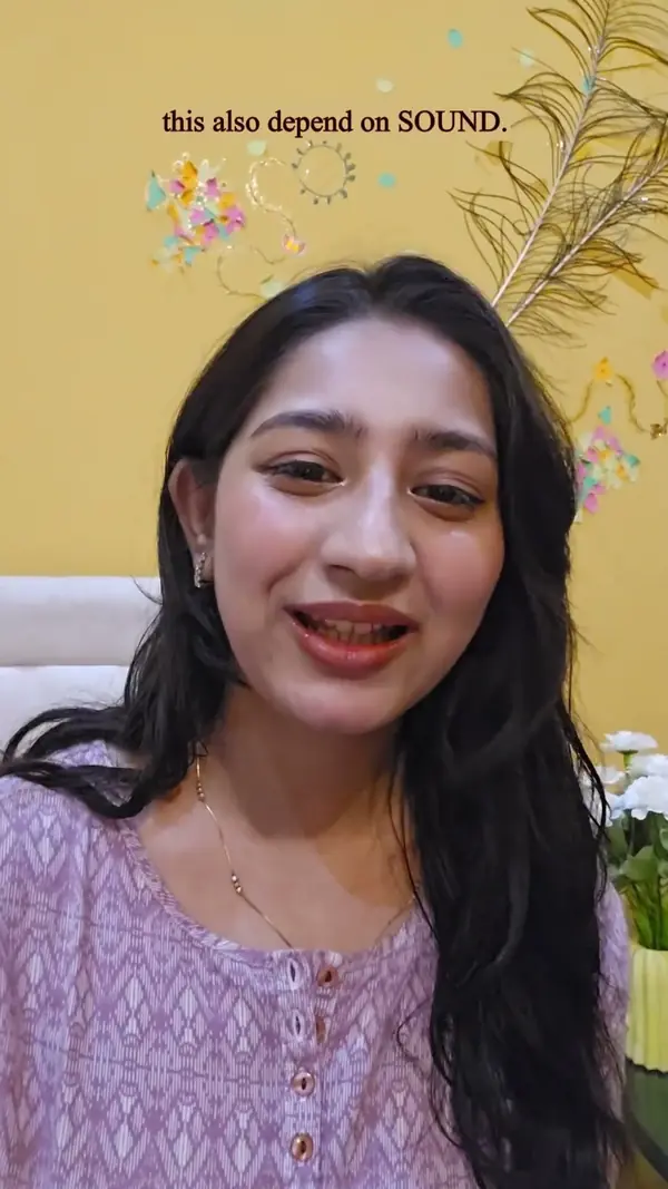 Esther in a lavender kurta explaining that the sound depends on the next word.